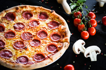 fresh italian pizza diavola with spicy salami, pepperoni & cheese