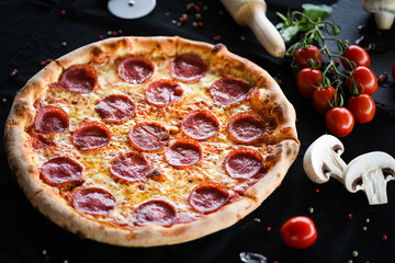fresh italian pizza diavola with spicy salami, pepperoni & cheese