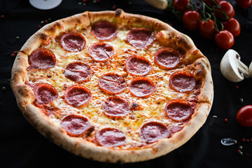 fresh italian pizza diavola with spicy salami, pepperoni & cheese