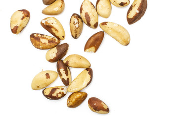 Lot of whole unshelled brazil nut flatlay isolated on white background