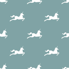 seamless fantasy pattern with silhouette of unicorns.