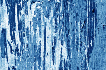 Fototapeta na wymiar Weathered painted wooden wall in navy blue tone.