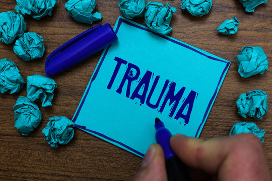 Text sign showing Trauma. Conceptual photo Disturbing physical and emotional injuries shock experience Cyan paper object thoughts crumpled papers ideas mistakes several tries