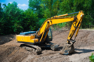 Fototapeta na wymiar An excavator working on a construction site
