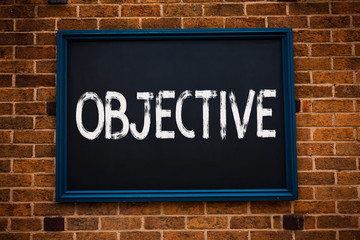 Conceptual hand writing showing Objective. Business photo showcasing Goal planned to be achieved Desired target Company mission Framed hang black board study class brick wall background