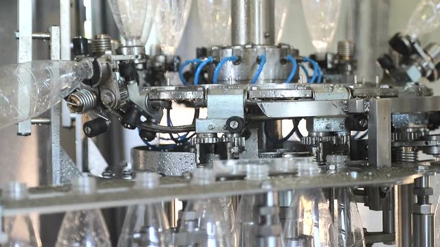 Plant for the production of mineral water. Water bottling in plastic white