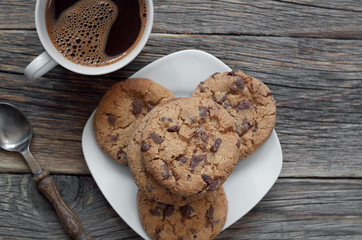 Coffee and cookies on table