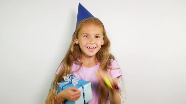 Laughing girl appears with a gift and whistles. 