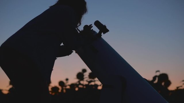 Amateur Astronomy Woman Looking To The Moon Or Planet Through Telescope, Silhouette