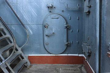 Sealed steel door on the ship deck
