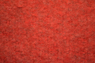 Fuzzy background. Knitted red texture. A fuzzy pattern of mixed fibers. Design. Background.