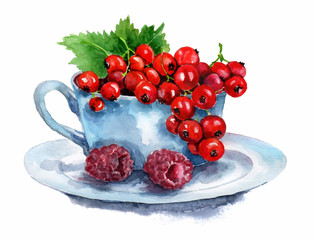 A cup on a saucer with currant berries and raspberries.