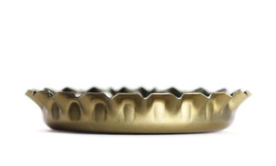 Macro golden bottle cap for beer isolated on white, side view 