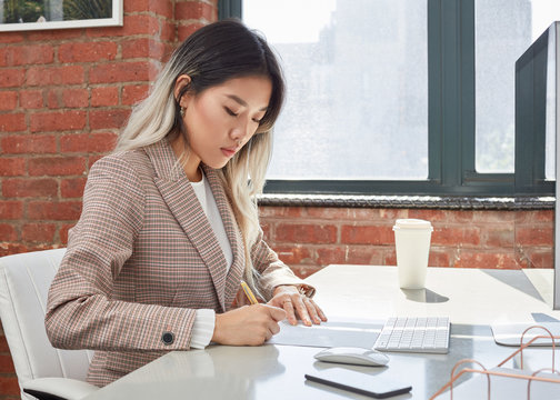 Business Woman at her desk at work 