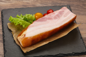 Smoked pork breast with salad leaves