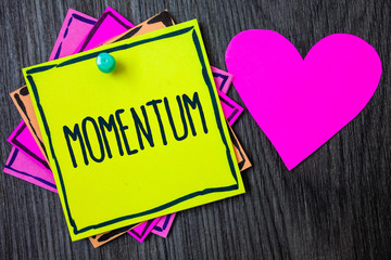 Handwriting text writing Momentum. Concept meaning Quantity motion in moving body Product of mass and velocity Border sticky remember cards love heart pinned dark woody background
