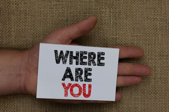 Writing note showing Where Are You. Business photo showcasing Give us your location address direction point of reference Human hand holding white page with black and red color texts on sack