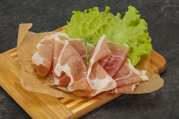 Italian prosciutto pork meat over board