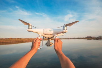 The drone and photographer woman hands