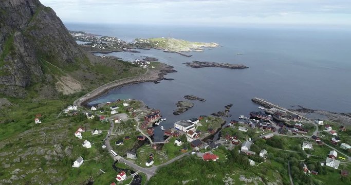 Aerial footage of A i Lofoten on popular Lofoten islands in Norway, Major tourist destination famous for natural beauty and typical red cabins.