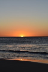 Sunset on the beach, orange, yellow and red colors.