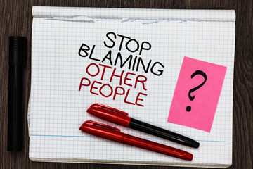 Word writing text Stop Blaming Other People. Business concept for Do not make excuses assume your faults guilt Color pen on written notepad with question mark black marker on woody deck