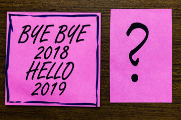 Text sign showing Bye Bye 2018 Hello 2019. Conceptual photo Starting new year Motivational message 2018 is over Violet color black lined sticky note with letters black question mark