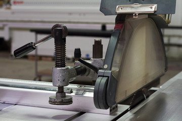 Extreme close-up detail of a circular saw machine, selective focus