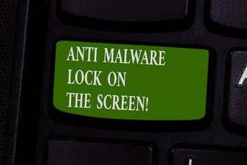 Word writing text Anti Malware Lock On The Screen. Business concept for Security safety against malware hacking Keyboard key Intention to create computer message pressing keypad idea