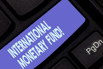 Handwriting text writing International Monetary Fund. Concept meaning promotes international...