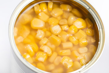 opened kernel sweet corn in brine canned , canned food isolated on white background