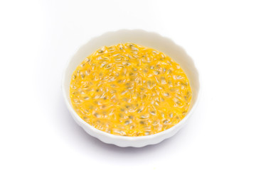 passion fruit juice in a bowl isolated on white background, sour fruit, fruit background, healthy food
