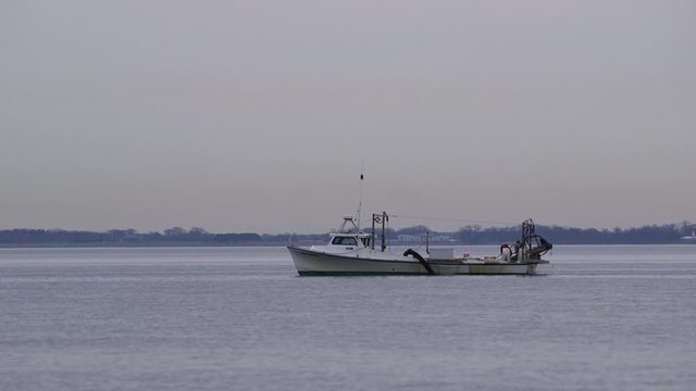 Fishing Boat Chumming the Waters