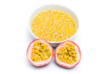 Fototapeta na wymiar Half cut passion fruit and passion fruit juice in a bowl isolated on white background, sour fruit, fruit background, healthy food