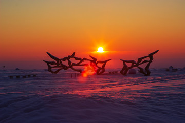 winter orange sunset over deserted Beach Laskovy in Saint-Ptersburg, Russia