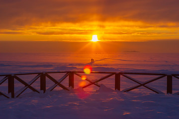 winter orange sunset over deserted Beach Laskovy in Saint-Ptersburg, Russia
