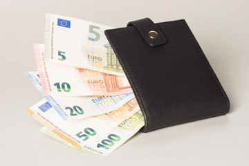 euro banknotes in purse