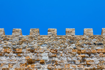 Old fortification wall detail under blue sky