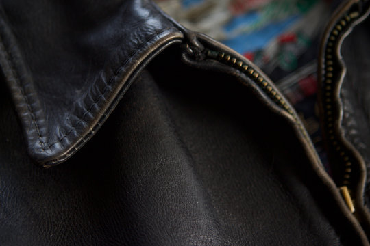 Detail of  black leather biker jacket collar