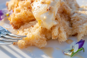 Honey cake. The original presentation is a broken cake.