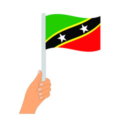 Flag of Saint Kitts and Nevis. Hand holding a Saint Kitts and Nevisflag - vector icon.