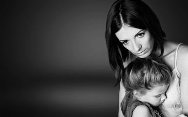 Portrait  of sad Mother with daughter