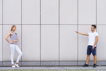 Fototapeta premium Man point finger at girl.