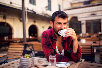 Man in shirt drinking coffee