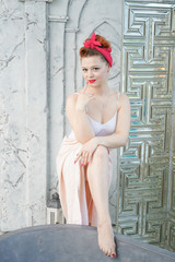 Young woman enjoying at luxury home. Soft photo of girl in white tender towel in her rich house in big modern bathroom with window