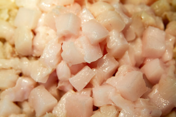 Frying chopped pieces of lard