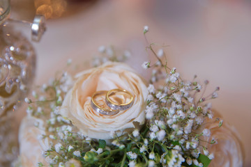Rings on wedding bouquets . Stylish white wedding flower .