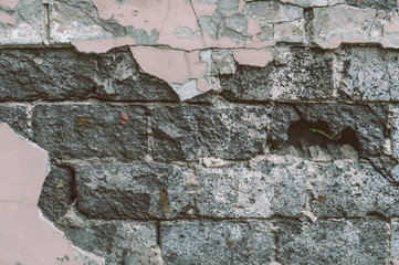 Urban background, ruined industrial brick wall with copy space. Old grunge wall texture. Hole in the concrete, the conceptual background