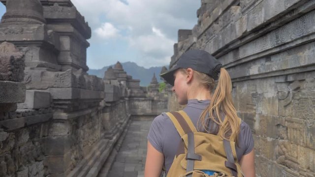 ourist backpacker exploring the Borobudur temple in Java island,Indonesia