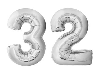 Number 32 thirty two made of silver inflatable balloons isolated on white background. Chrome silver helium balloons forming 32 thirty two. Birthday concept